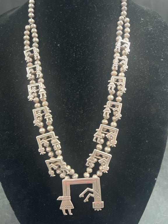 Vintage Navajo Yei Bi Chei SS Squash Necklace: Rainbow guardian necklace. Featuring stylized figures or rainbow guardians. Measures 27" and pendant is 2" x 2 1/4". Condition is good, see pictures. Total weight is 134.3g. No refunds