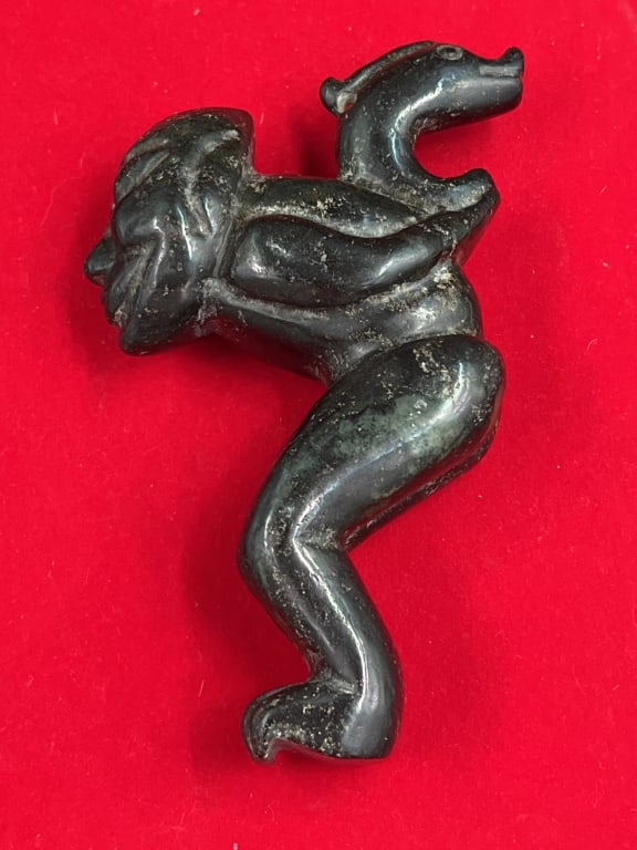 Black Stone Carving Hongshan Culture: Depicted as a "Sun God" or "Alien" figure. Measures 6" x 3.5" x 1 1/4". Carved from jade?. See pictures. No refunds given.Condition Information: It is the responsibility of the buyer to obtain