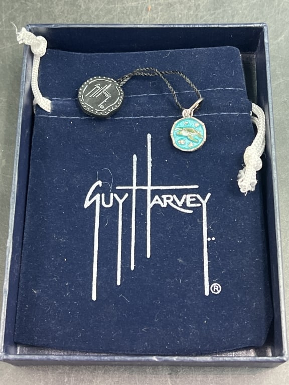 Guy Harvey Pendant: Nice piece that comes with original hang tag and cloth bag. Swivel clasp, see pictures. Weighs 3.2g and condition is good. No refunds given.Condition Information: It is the responsibility of