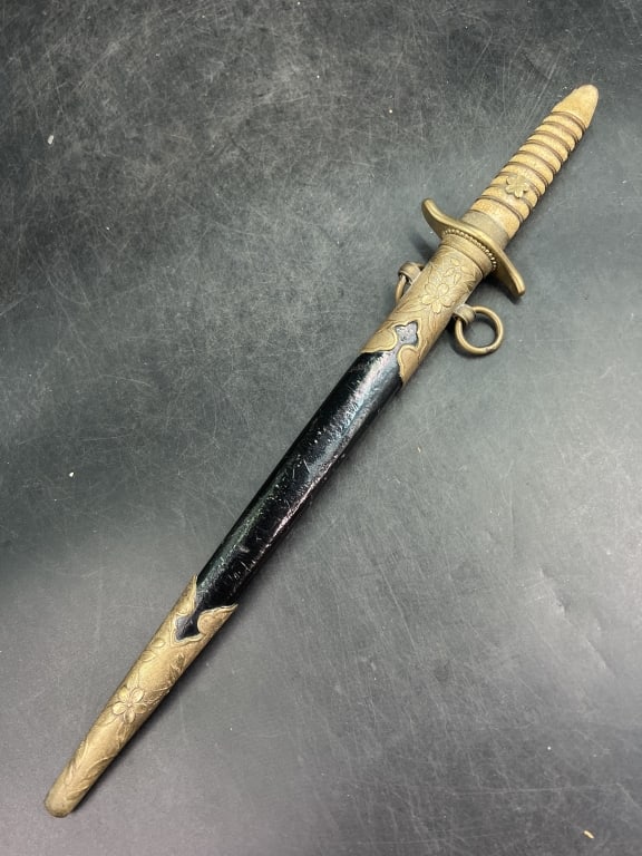 Japanese WWII Naval Officers Dirk: With brass mounted leather scabbard. Measures overall in scabbard 16". Condition is consistent with age and use, see pictures. No refunds given.Condition Information: It is the responsibility