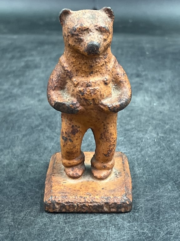 Vintage Cast Iron Bear: Produced around 1949 Louisville, Kentucky. Promotional advertising piece for international harvesters. Symbolized the International Harvesters Cadet Cub tractors. Measures 4.5" and condition