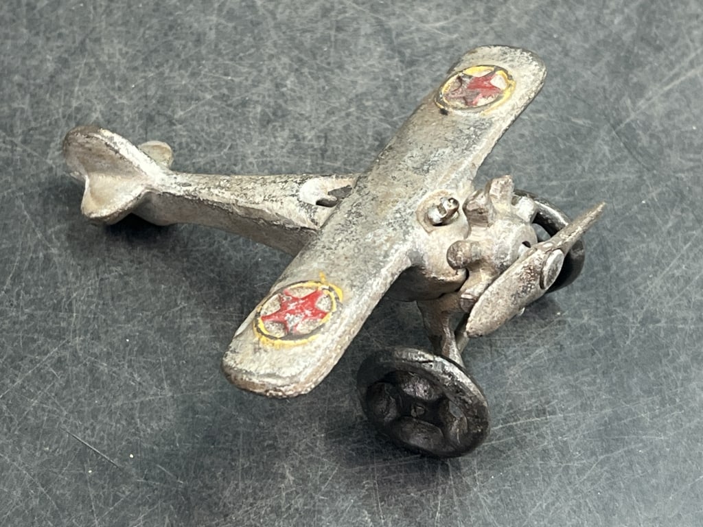Vintage Cast Iron Airplane: Neat piece that measures about 4.5" x 4". Condition is consistent with age and use, see pictures. No refunds given.Condition Information: It is the responsibility of the buyer to obtain all