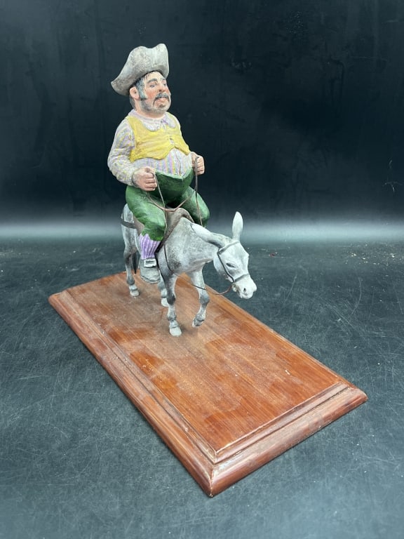 Sancho Panza Riding a Donkey: Classic Spanish novel Don Quixote. Figure is authentic hand carved wood. Figure measures 11" x 8 1/2" and on wood base (14" x 7 1/4"). Marked Arnold Roberts on bottom. Condition is consistent