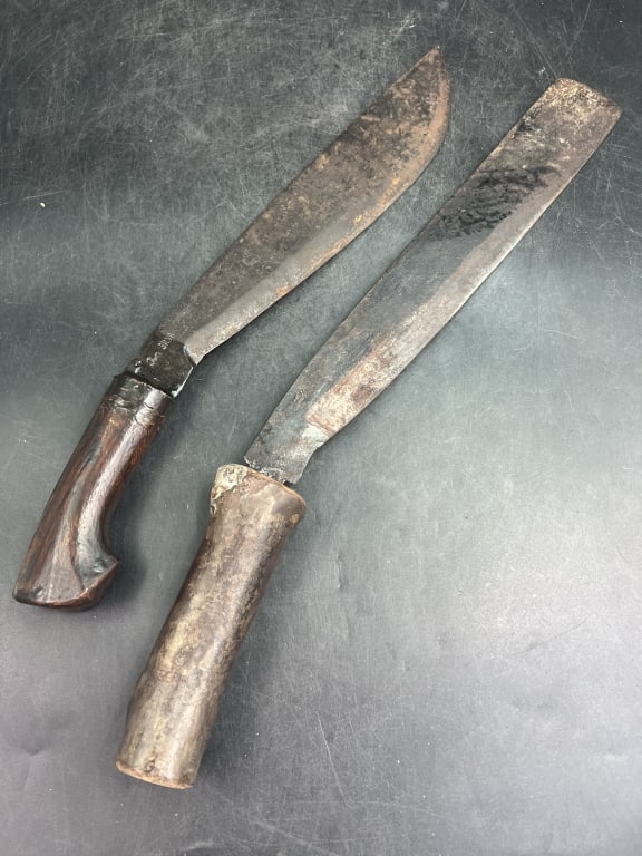 Vintage Plantation Machetes: Both very heavy steel and sharp. Both have marks on blade see pictures. Condition is consistent with age and use, no refunds given.Condition Information: It is the responsibility of the buyer