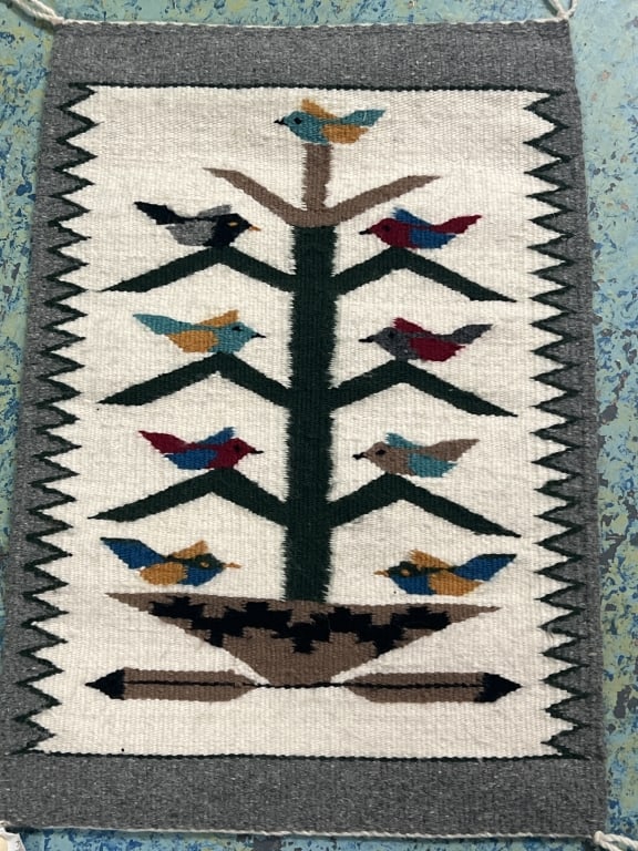 Indian Rug Artist 'Rose Bitah: Piece has original tag and picture of artist with rug. Measures 20 3/4" x 14 1/4". Hand woven rug with vibrant colors and birds in a tree. Condition is good, see pictures. No refunds