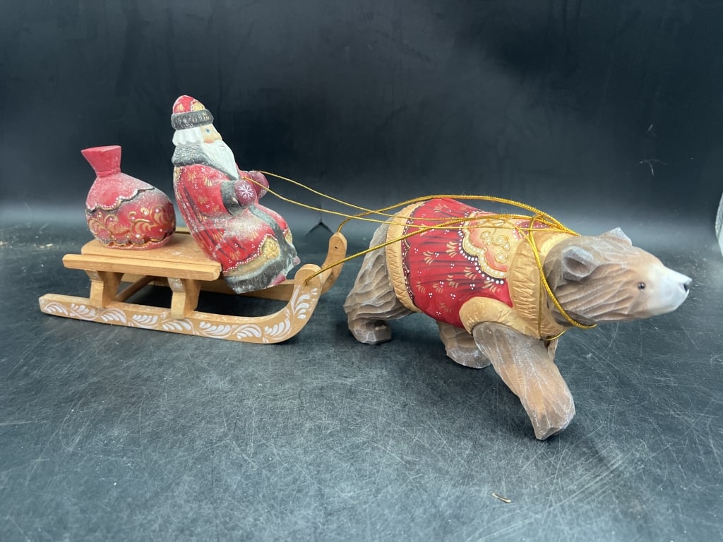 Russian Father Frost with Sled: Carving depicting Santa Claus in a sleigh being pulled by a bear. Hand carved from linden wood intricately detailed. Measures 6" x 8.5" and 4.5" x 7" x 5". See pictures, no refunds