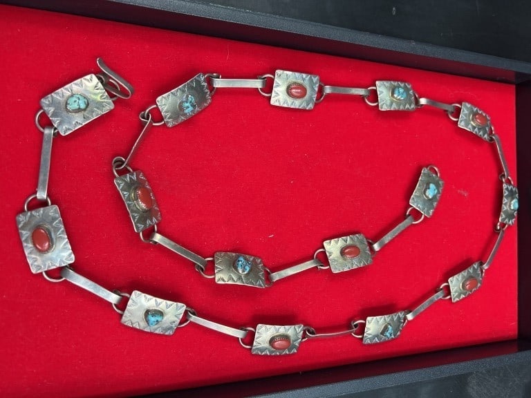 Concho Belt Signed: Neat piece that measures `about 41". Has coral and turquoise. Signed by artisit, see pictures. No refunds given.Condition Information: It is the responsibility of the buyer to obtain all