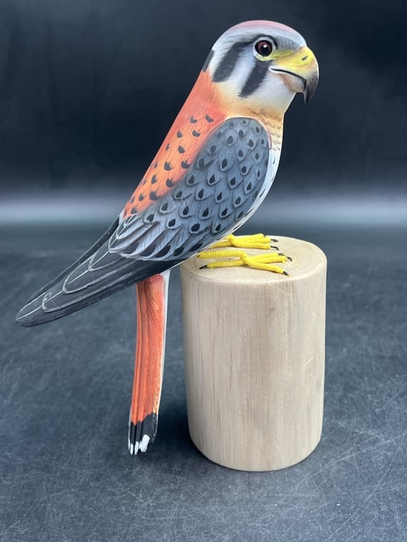 American Kestrel Wooden Sculpture: Carved wood typically basswood or suar wood. Features detailed feather painting and glass eyes. Measures 8 1/4" x 6". Condition is good, see pictures. No refunds given.Condition Information: 