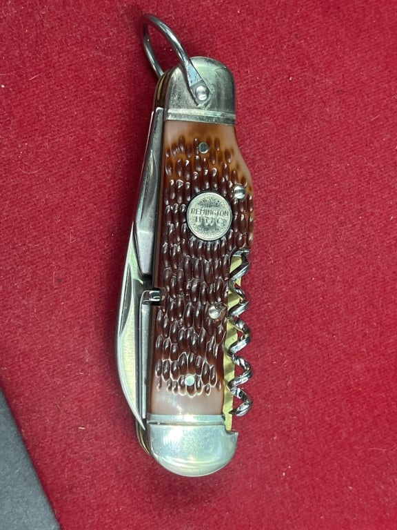 Remington UMS USA Folding Knive: Featuring a bone handle and a corkscrew attachment. Often identified as a "Camp" or "Scout" knife pattern. Condition is consistent with age and use, see pictures. No refunds given.Condition Informatio