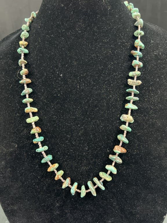 Navajo Turquoise and Silver Necklace: Nice piece that has pieces of turquoise, beads and sterling. Measures 26.5" and condition is good, see pictures. No refunds given.Condition Information: It is the responsibility of the buyer to