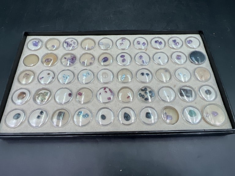 Gemstone: Nice tray with approximately 50 containers of various gemstones. There is Ruby, Diamonds, Amethyst, Topaz, Aquamarine, etc. See pictures, condition is consistent with age and use. No refunds