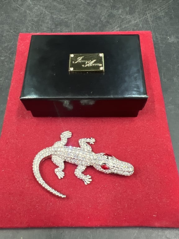 Isabella Adams Gator Paperweight: Comes with original box. Has crystals light siam eyes. Measures 2.5" x 1 3/4". Condition is good, see pictures. No refunds given.Condition Information: It is the responsibility of the buyer