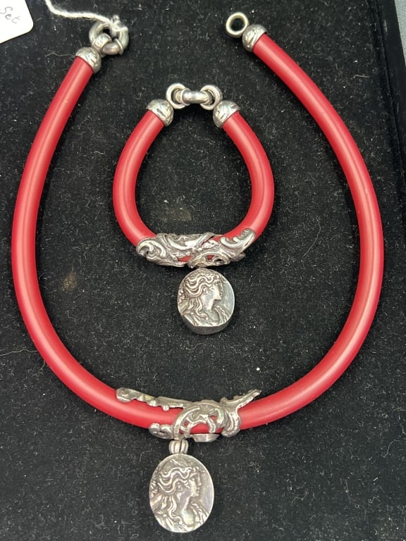 Italian Jewelry Folli Follie 'Signed': Set comes in choker and bracelet. Both have thick corded tops and silver dangles on both. Condition is good, see pictures. No refunds given.Condition Information: It is the responsibility of