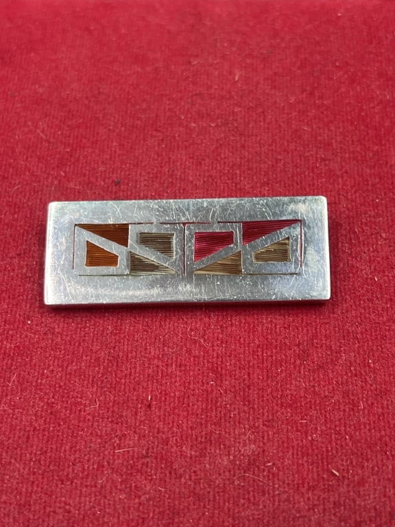 Vintage Modernist Sterling Rectangular Brooch: Marked on back 925 and Forbes. Measures 2" x 3/4". Brooch has gemstones inlay 'heavy". Total weight is 17.9gCondition Information: It is the responsibility of the buyer to obtain all possible