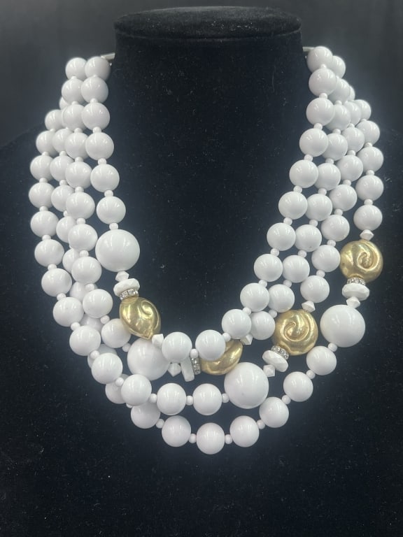 Fiocchi Italy Necklace: Multi strand necklace featuring white beads and gold tones spacers from 1950's. Total of 4 strands. Condition appears good, see pictures. Marked piece. No refunds given.Condition Information: 