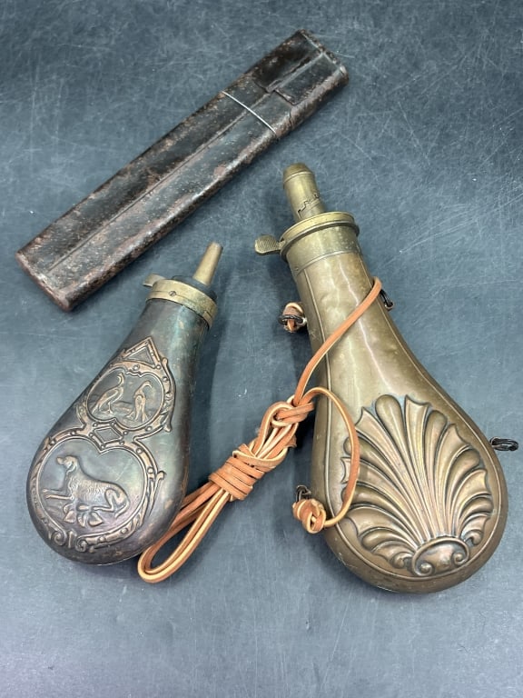 Vintage Lot: In this lot is 2 brass black powder flask. Both have raised shell designed. The other piece is civil war case with wicks for cannon. Condition is consistent on age and use, see pictures. No refunds gi