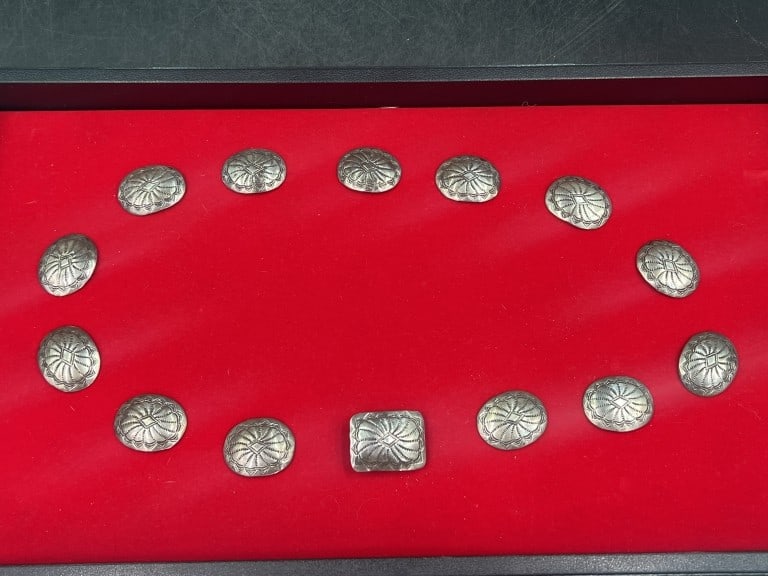 Sterling Concho's Signed 'RB': There is 13 Concho's and 1 Concho buckle. They weigh a total of 45.3g and condition is consistent with age and use, see pictures. No refunds given.Condition Information: It is the