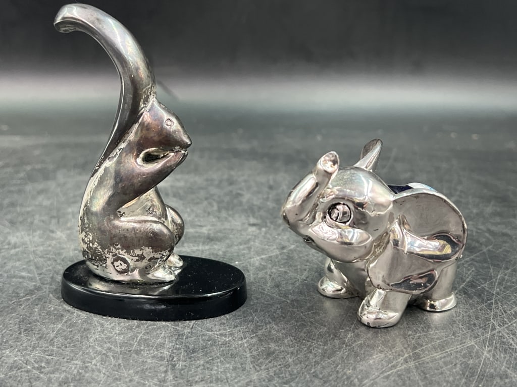 Vintage Silver Animals: Made in Italy, see pictures for mint marks. There is a elephant with Murano glass on his back 2" x 3". The squirrel measures 3 3/4" x 1.5" w/o base.Condition Information: It is the