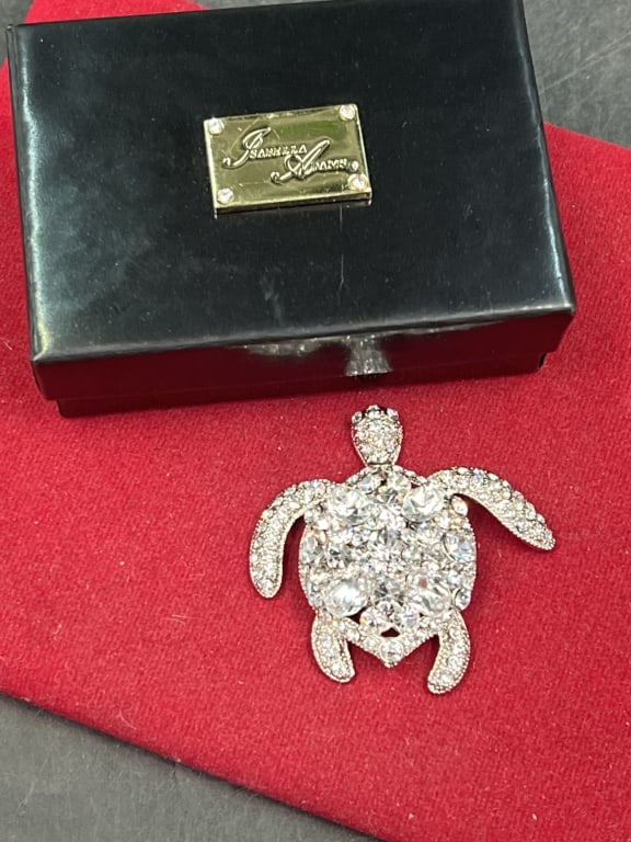 Isabella Adams Crystal Sea Turtle Paperweight: Comes in original box. Small Clear Crystal Sea Turtle Paperweight adored with premium crystal on a Rhodium Plated Body. Designed and made in USA. Measures about 2" and condition is good. See