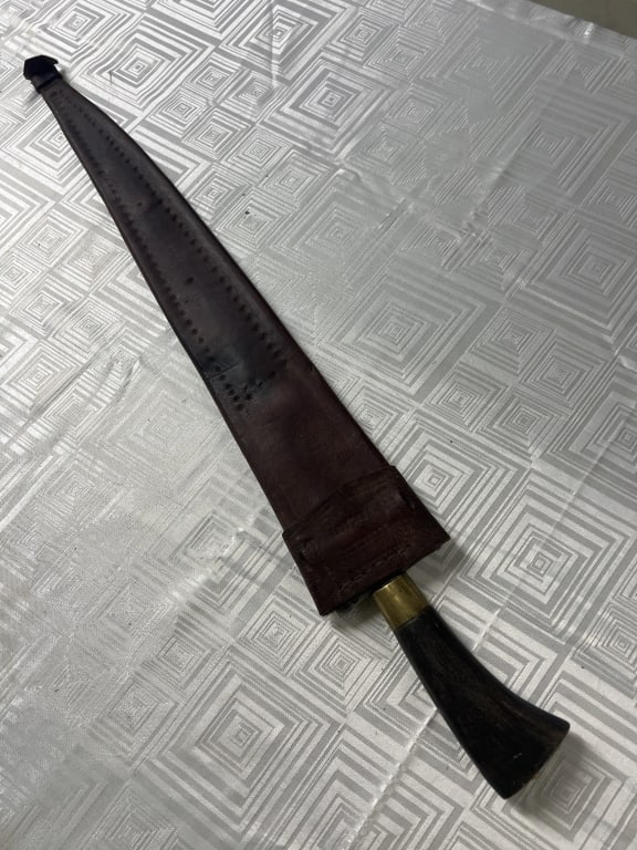 Antique Kris Dagger/Sword: Comes with sheath. Kris sword with wavy blade. Measures overall with sheath 25.5". Condition is consistent with age and use, see pictures. No refund given.Condition Information: It is the