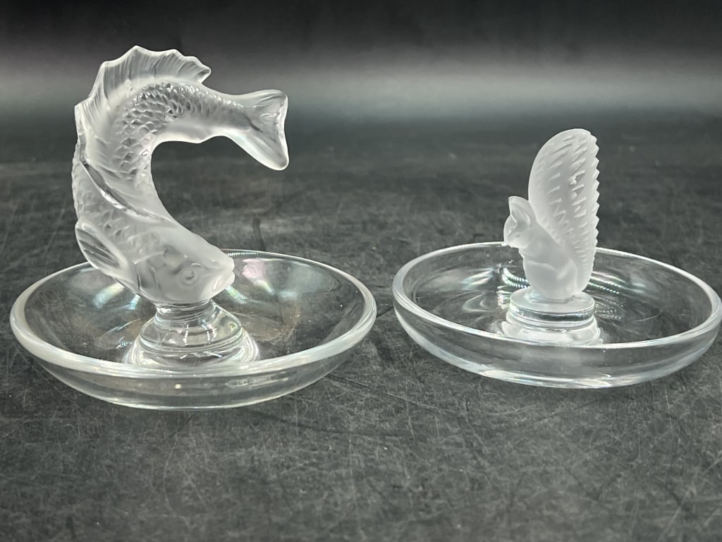 Lalique Frosted Crystals: One is a Leaping Koi Fish Ring Dish. Measures 3.5" and the other is a Crystal Squirrel Ring. Measures 2.25". Both are Lalique, France and marked. Condition appears good. See pictures. No