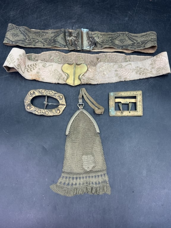 Collection of Vintage Accessories: Items include 2 embroidered or fabric belts with metal clasps. Antique metal purse late 19th or early 20th century. Lastly 2 additional decorative metal belt buckles, one ornate and one more