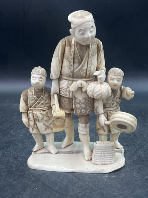 Japanese Figure Man with Two Sons: Likely from Mejii period (1968-1912) depicting man with children. Scene of daily life of father with sons. Measures 5 1/4" x 4". Condition is consistent with age and use, see pictures. No