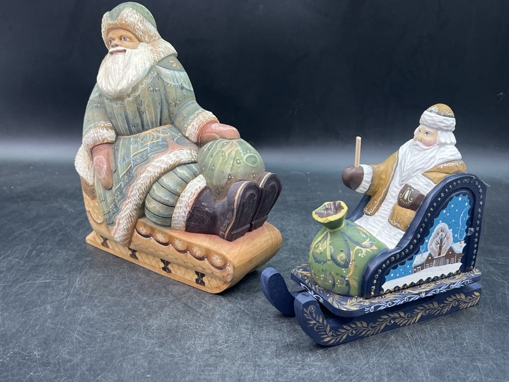 Russian Santa Claus Figurines and Penquins: Nice lot that is hand carved and hand painted. Santa seating on sleigh and other Santa has Penquins. See pictures. Condition is consistent with age and use. No refunds given.Condition