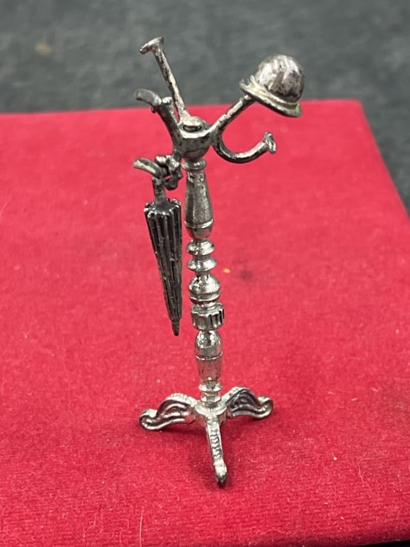 Vintage Sterling Coat Hanger Dollhouse: Great piece that measures 3' h. See pictures, very detailed piece from hat hanging to umbrella. Weighs 24.0g. Condition is good, see pictures. No refunds given.Condition Information: It is