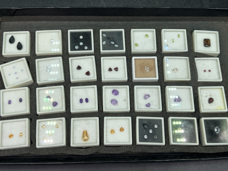 Gemstones: There is a total of 28 holders with a variety of gemstones. There are amtheyst, rubys, diamonds, etc. See pictures, condition is consistent with age and use. No refunds given.Condition