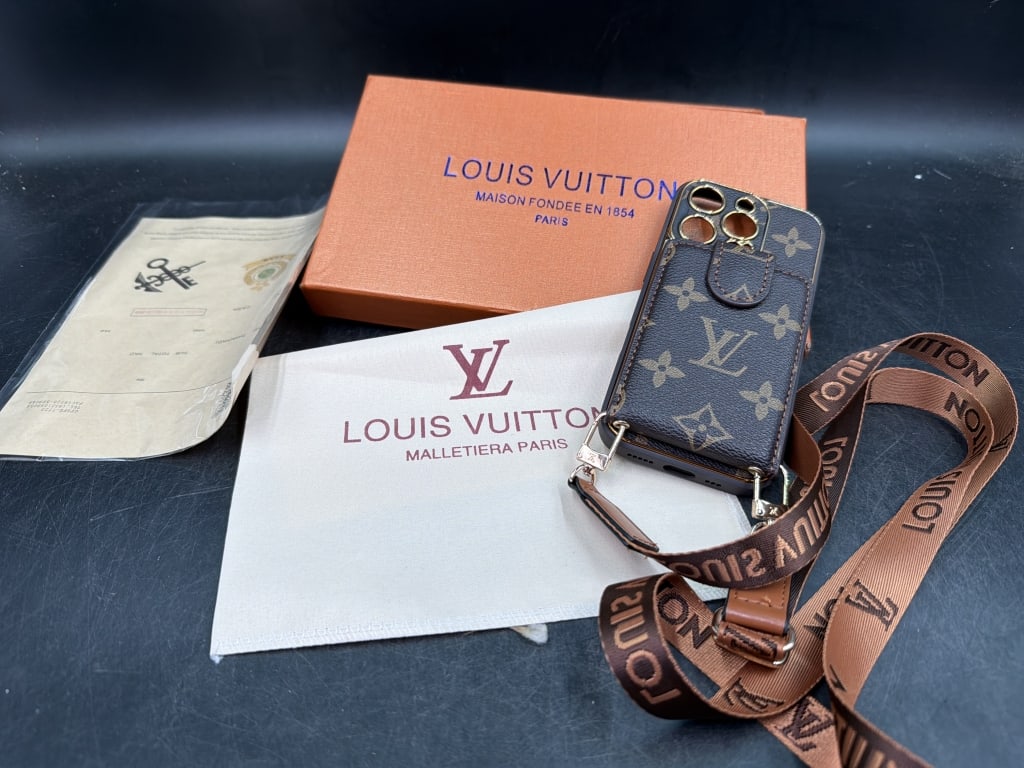 Louis Vuitton Phone Case with Wallet and Strap: Cases designed to combine luxury styling with everyday functionality. comes with box, see pictures. Condition appears good. No refunds given.