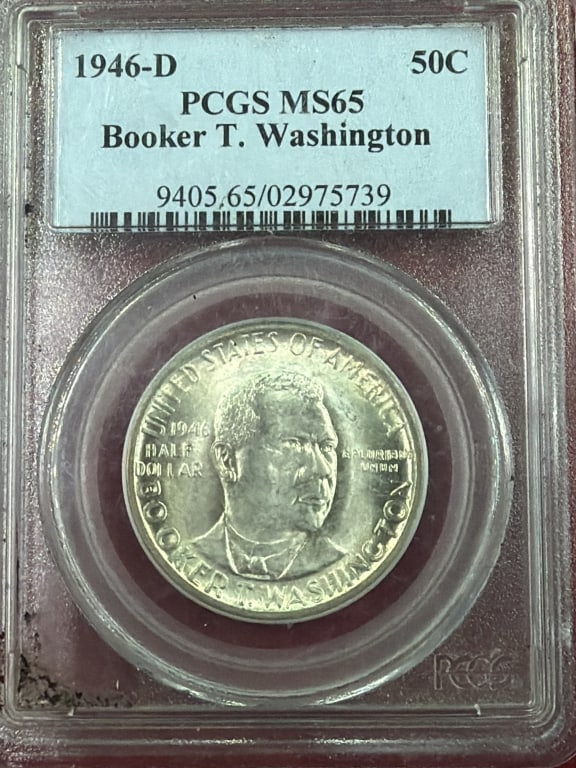 1964-D Booker T Washington Silver Dollar: Certified by PCGS as MS65. MS65 indicates high grade uncirculated coin with above aver luster and minimal contact marks. Designed by Isaac Scott Hathaway and features portrait of Booker T Washington