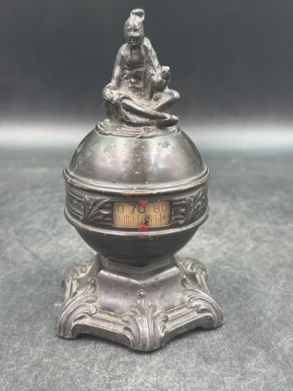 Antique Therm-o-Dial with Native American Figure: Thero Dial Laboratories of Newark, New Jersey. Produced around the 1920's. Cast Functional indoor thermometer and desk paperweight. Constructed of metal with a decorative base and globe housing the