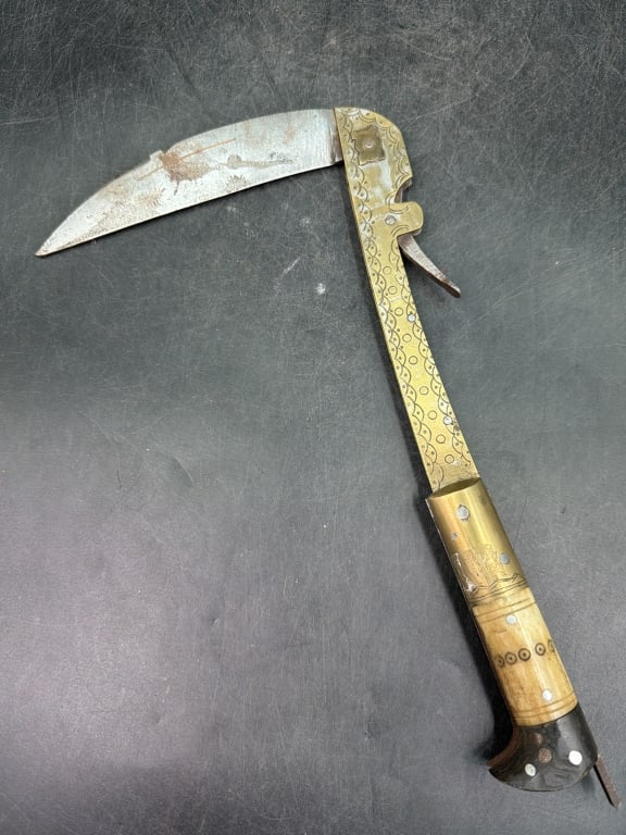 Afgani Islamic Folding Axe: Used by Banuchi tribe. Folding sickle knife featuring a curved blade and handle often construction from brass and bone. Condition is consistent with age and use, see pictures. No refunds given.