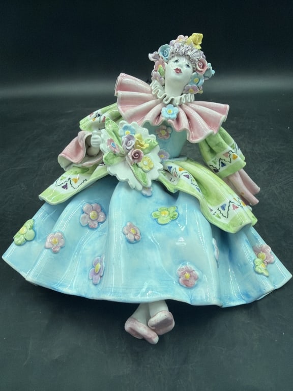 Vintage Porcelain Pierrot Clown Figurine: Gump;s San Francisco by Gruppo Dei Quattro Italy. Meticulously detailed pastel costume with pink ruffled collar and colorful cape. Adorned with delicately sculptured flowers on the cap, dress and