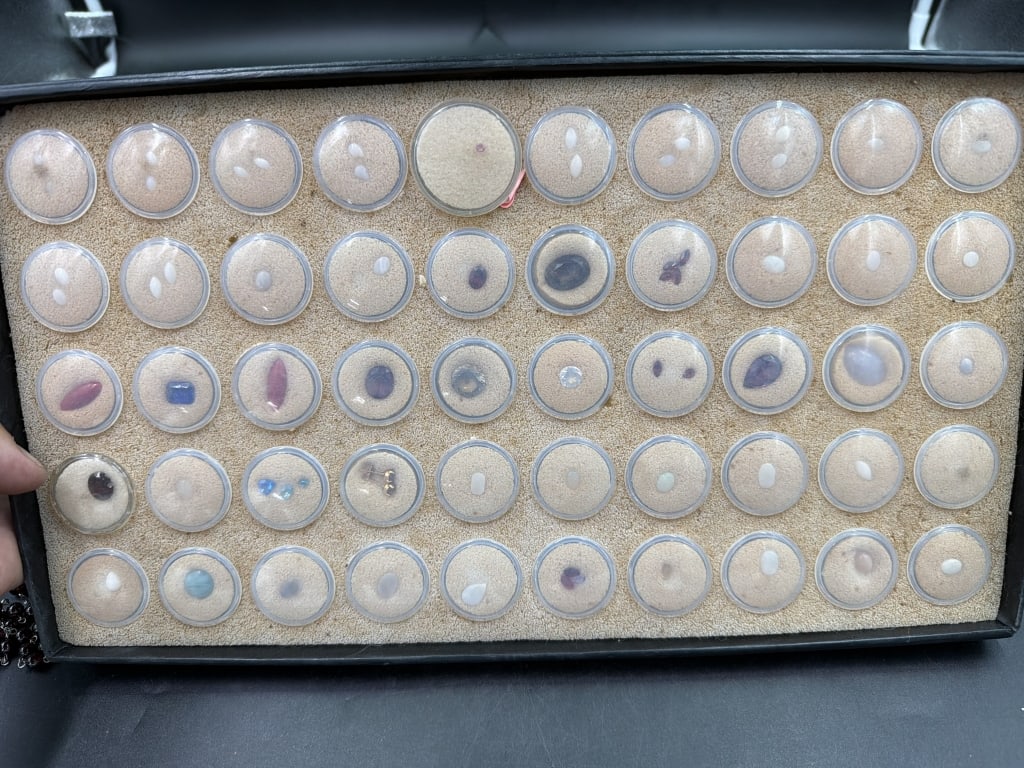 Gemstone Lot: Total of 10 circular cases with gemstones. There is topaz, white beryl and many others in this lot. Look at pictures. No refunds given.