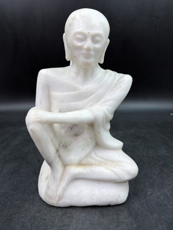 Carved White Stone Buddish Monk: Hand carved piece white marble Burmese monk statue. In the Mandalay style. Depicts Buddhist figure. Measures 9.5" x 5.5". Condition is consistent with age and use, see pictures. No refunds given.