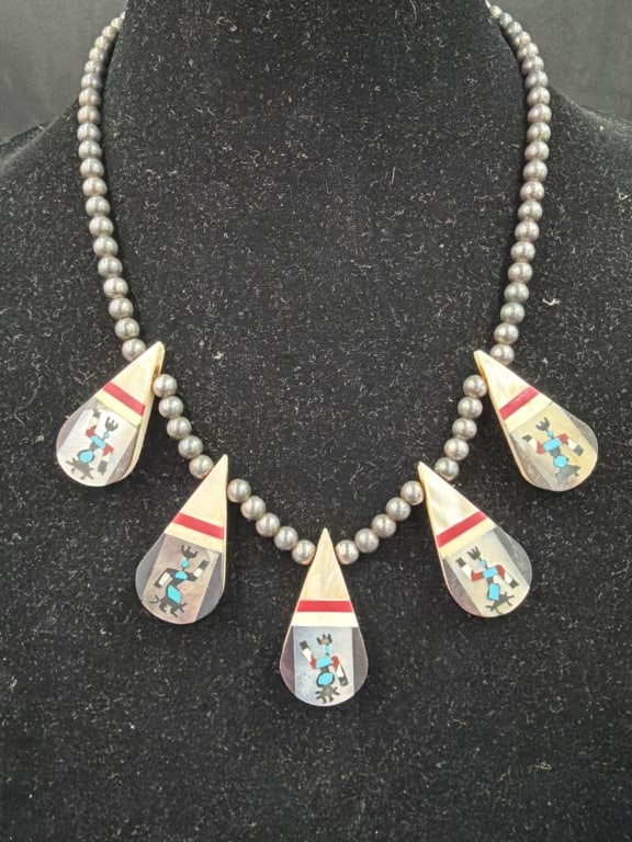 Vtg Native American Santo Domingo Pueblo Necklace: Sterling silver necklace often referred to a as "battery bird" necklace. Features distinctive teardrop shaped pendants with mosaic inlay work depicting birds. Measures 20" and weighs 47.6g. Condition