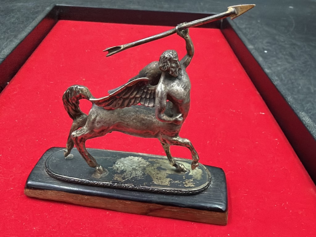 Vintage Sterling Sculpture with Mythical Features: Creature is part human and part horse mounted on base. This version includes wings, which is less common for standard centaurs. Figure is shown in a dynamic pose holding a long spear like object.