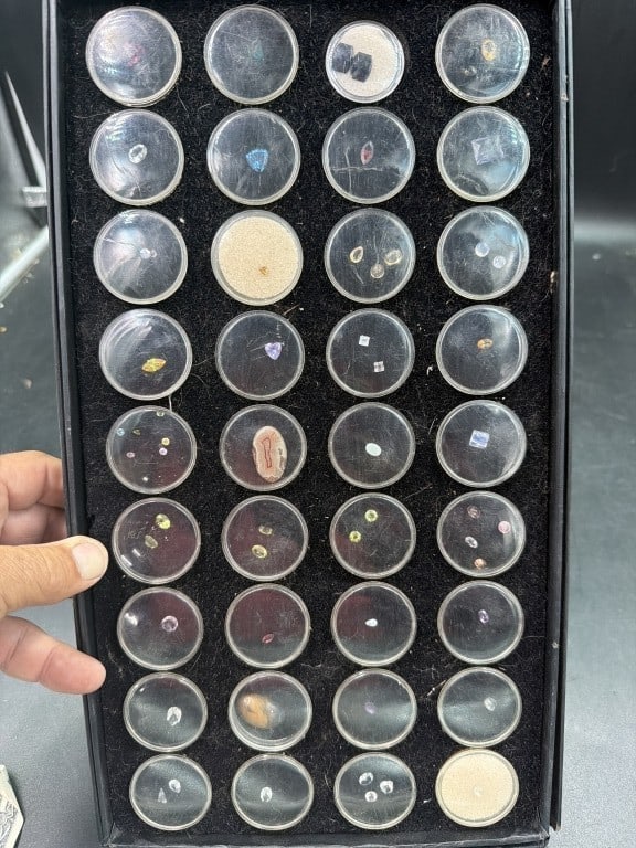 Gemstones: Huge lot of gemstones. Total of 50 circular gemstones holders. There is a variety of gemstones. See pictures. No refunds given.