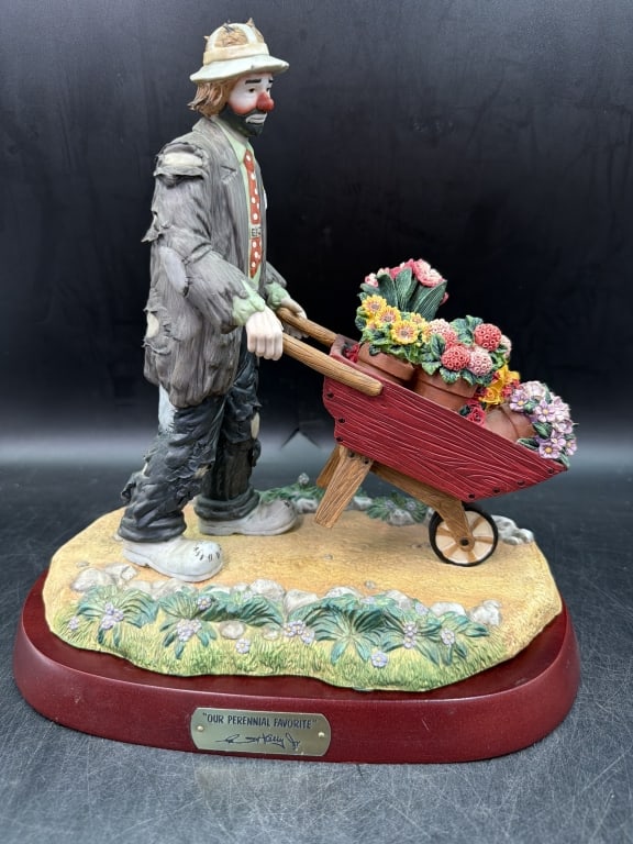 Emmet Kelly 'Our Perennil Favorite' LE: Featuring hobo clown pushing a flower filled wheelbarrow. LE 0170/1500 and comes with wood base. Figure measures 12.5" x 10" x 5.5". Condition is good, see pictures. No refunds given.