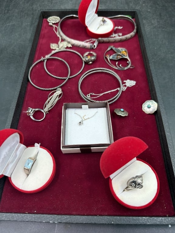Sterling Jewelry: There is 5 rings, 2 chains, 2 chains w/pendants, 2 pair earrings, 4 bangle bracelets, 1 brooch, 1 pendant1 necklace. See pictures, condition is good. Weighs 163.9g. No refunds given.