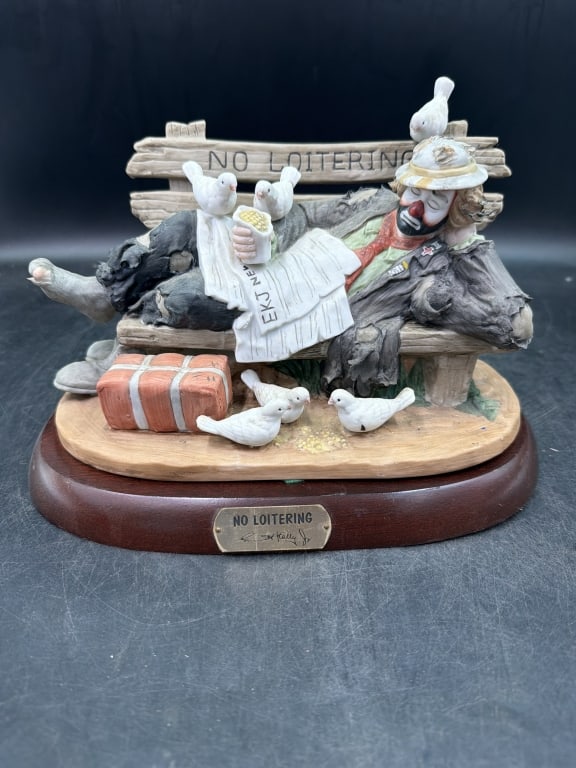 Emmet Kelly LE 'No Loitering' LE #1844/7500: Porcelain clown figurine manufactured by Flambro and mounted on wooden base. Hand painted bisque porcelain and signature back stamp. LE piece and condition is good. Measures about 7" x 9". No refunds