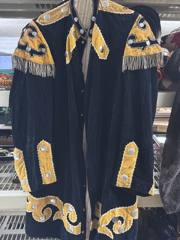 Vintage Style Black Suede Jacket: Neat jacket featuring yellow accents, fringe detailing and decorative silver studs. Jack resembles antique regalia, specifically from organizations such as the Independence Order of Odd Fellows.