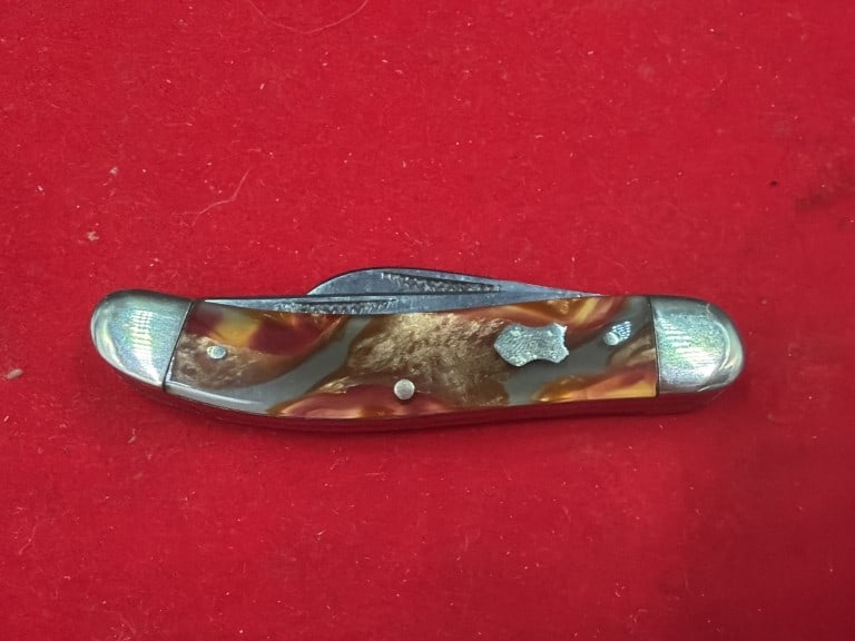 Vintage 'Bull Dog' German Pocketknife: Vintage pocket knife feasturing colorful, marble celluiod scales and nickel silver bolsters. Vibrant imitation tortoise sell or aged honey amber composite handles. Stainless steel blades made in