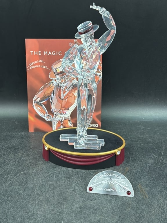 Swarvoski 2003 'Antonio' Figurine: From the Magic of Dance collection featuring a clear crystal flamenco dancer on a red and black base. Comes with original box, papers, stand, etc. Condition is good, see pictures. No refunds given.
