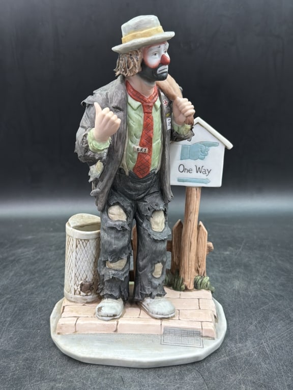 Emmet Kelly Jr LE #1287/9500: Flambro Emmett Kelly Jr figurine title "On the Road Again". LE porcelain piece clown character hitchhiking next to a "One Way" sign. Measures about 10" and condition is good, see pictures. No refunds