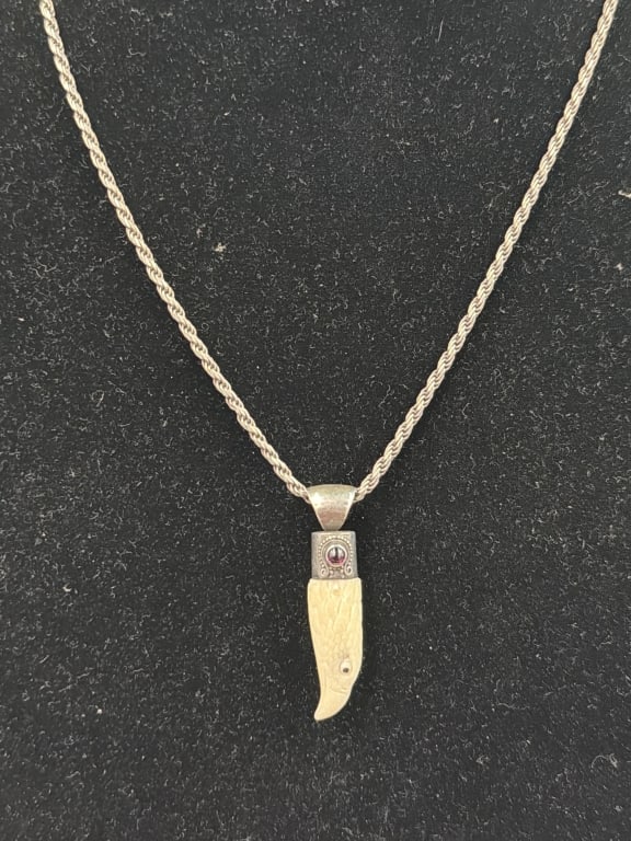 Sterling Silver Chain with Tooth Pendant: Pendant is carved eagle. Neat silver cap on top and great silver chain. Weighs overall 19.6g with pendant. Condition is good, see pictures. No refunds given.