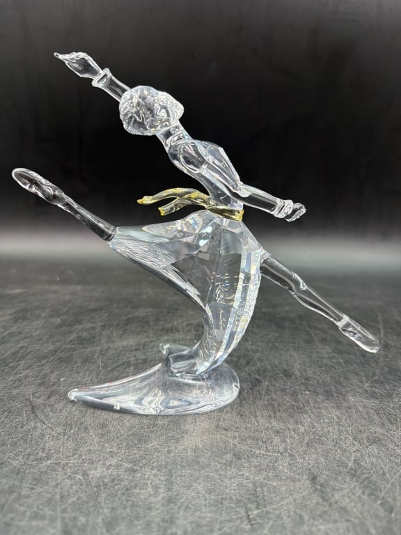Swavorski Figurine in Box 'Anna': Magic of Dance collection. Clear crystal with a gold colored crystal belt. Measures about 7.5" and comes with original box. Condition is good, see pictures. No refunds given.