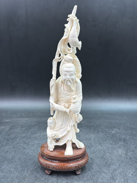 Antique Fisherman Figurine 'Shou Lao': God of Longevity. Depicts a bearded elderly man holding a staff a and child by his leg. Symbolizing wisdom and long life. Measures 10 1/4". Condition is consistent with age and use, see pictures. No